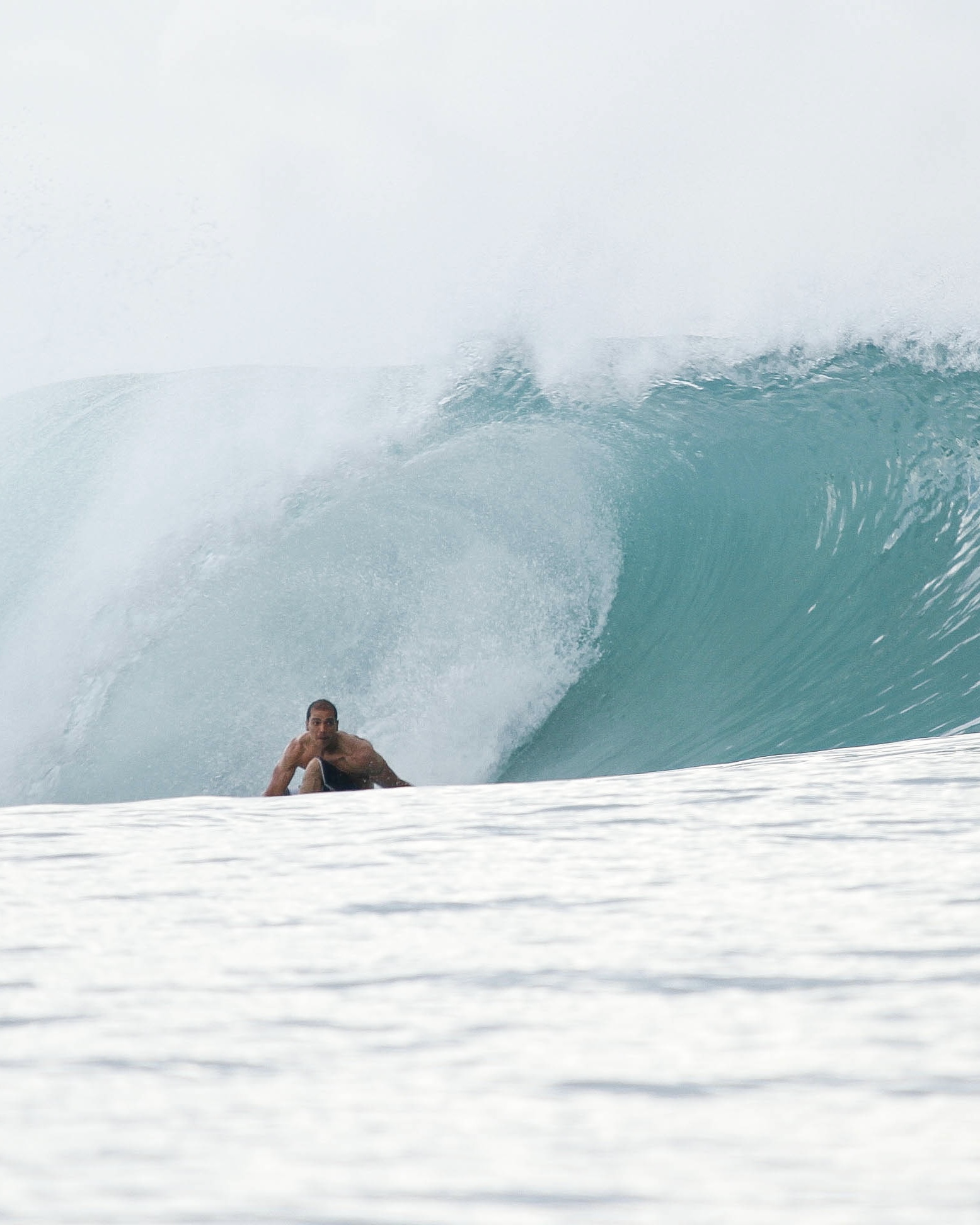 Idris surfing in Indonesia